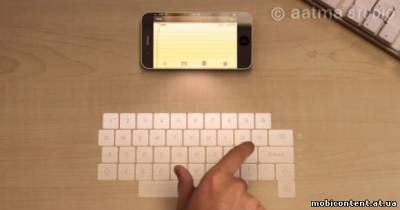 Концепт iPhone 5 с голографическими клавиатурой и дисплеем